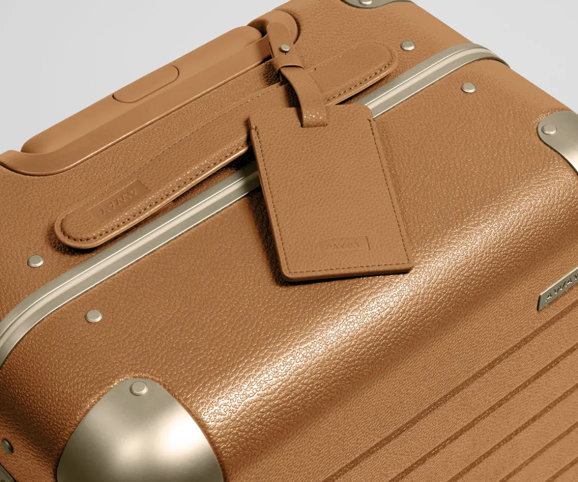 The Aluminum Edge Bigger Carry-On in Cognac Brown