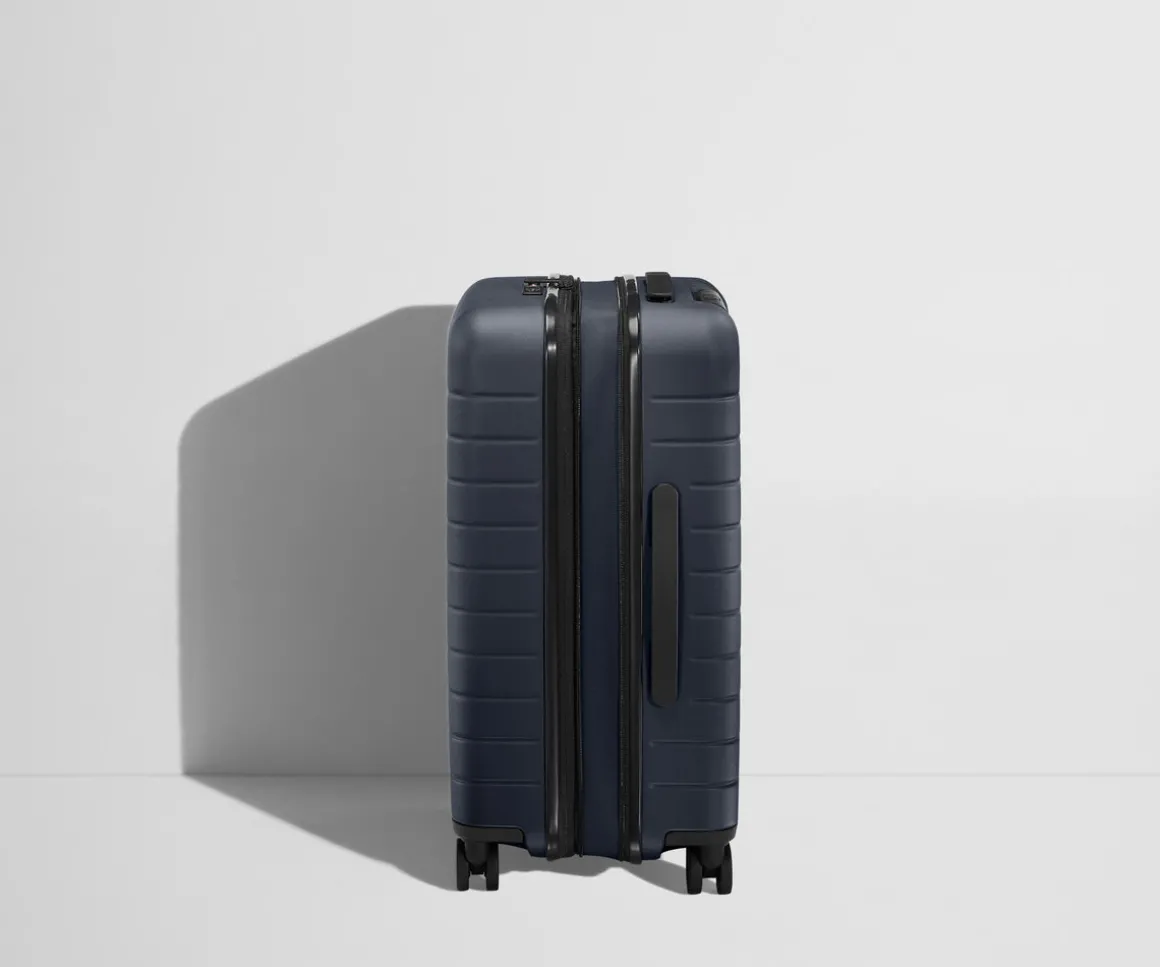 The Bigger Carry-On Flex in Navy Blue