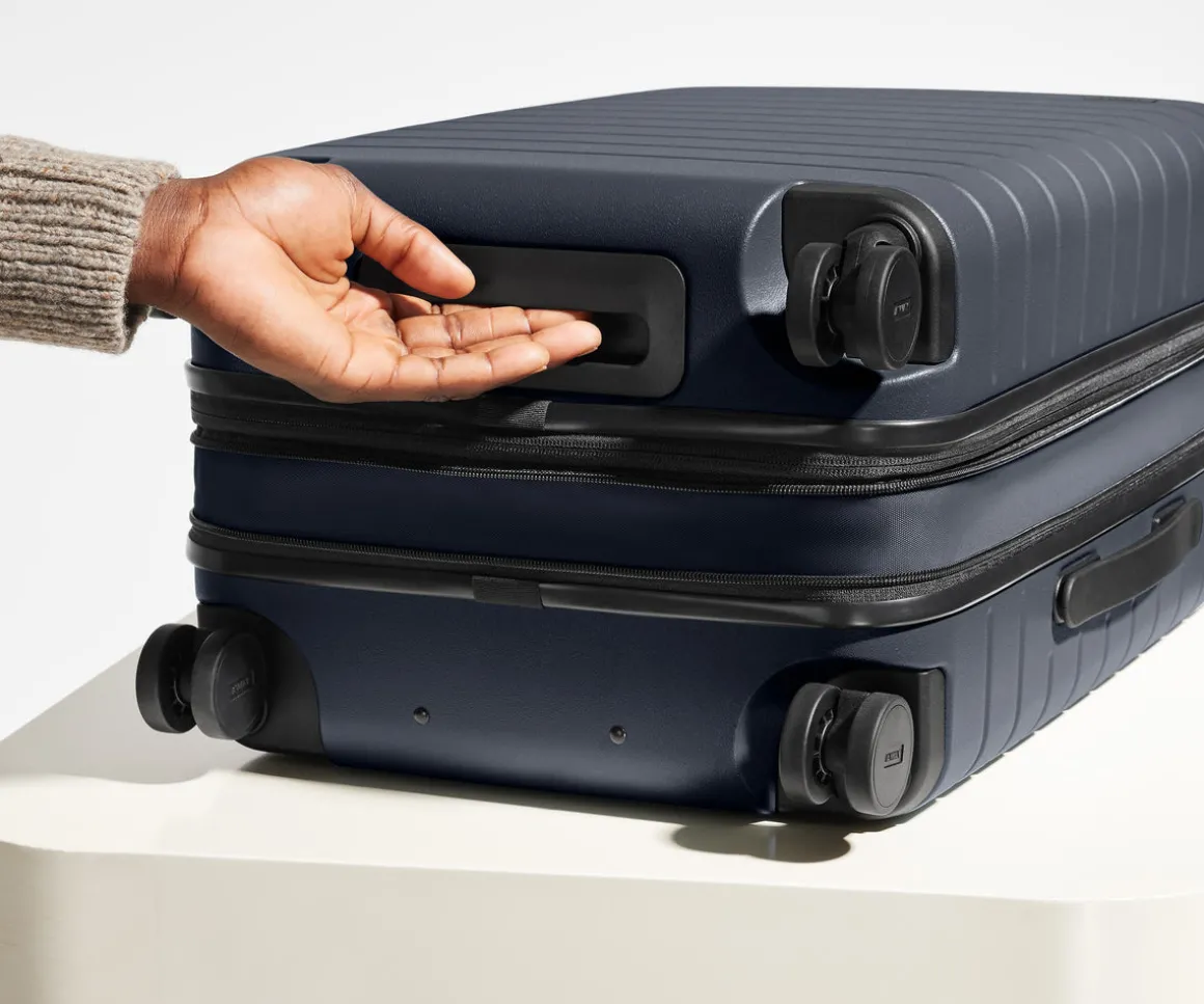 The Bigger Carry-On Flex in Navy Blue